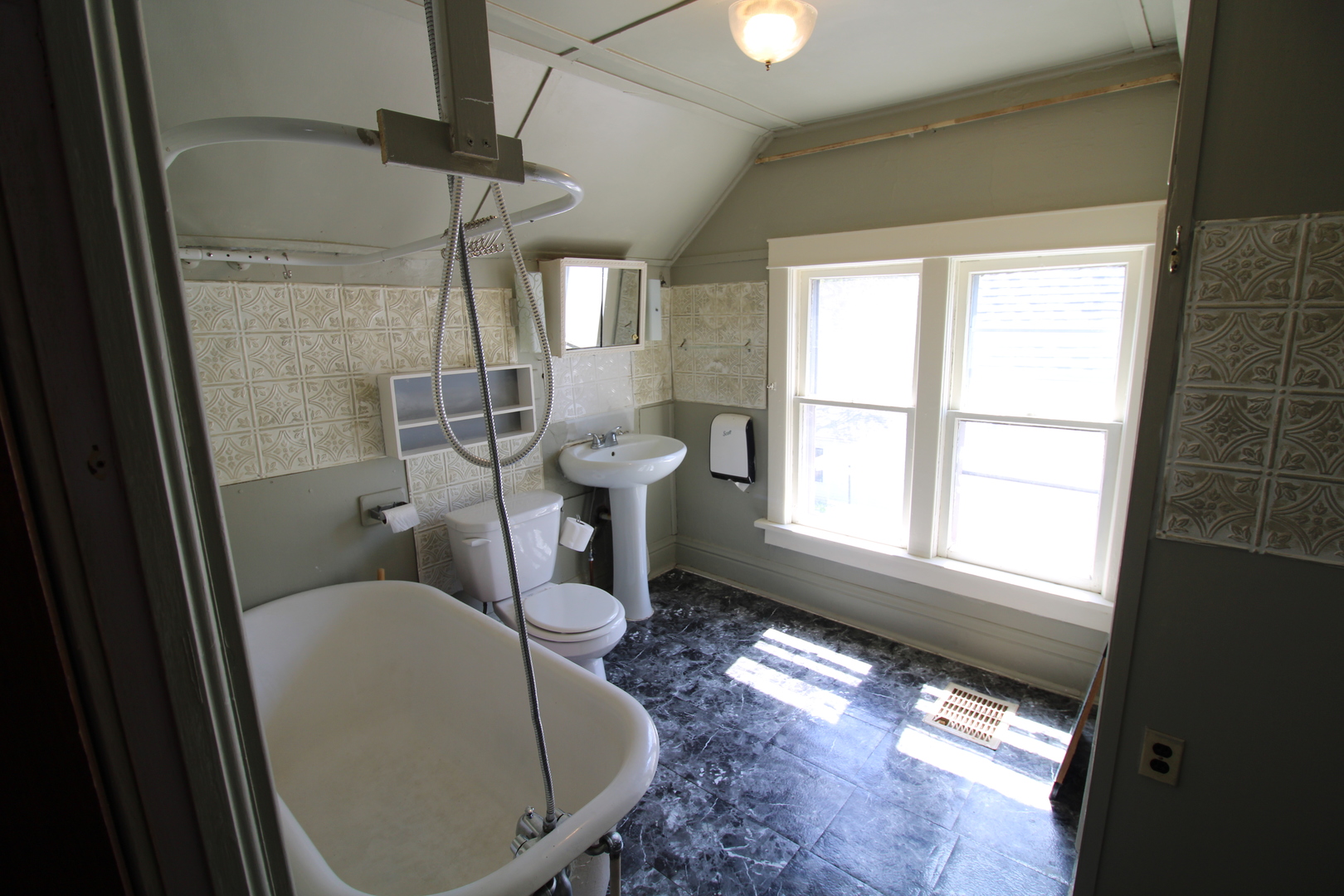 1176 22nd Street Moline, IL 61265 - Photo 14 of 19 a bathroom with a toilet tub sink and mirror
