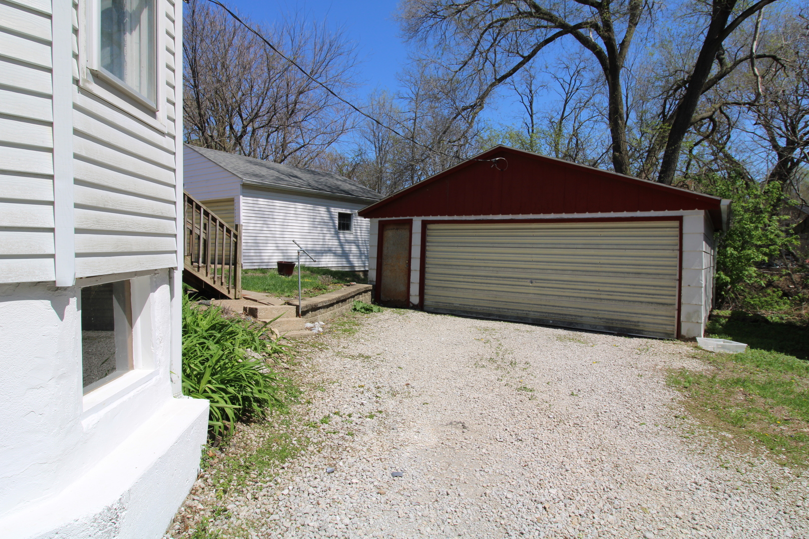 1176 22nd Street Moline, IL 61265 - Photo 18 of 19 a front view of a house with a yard and garage