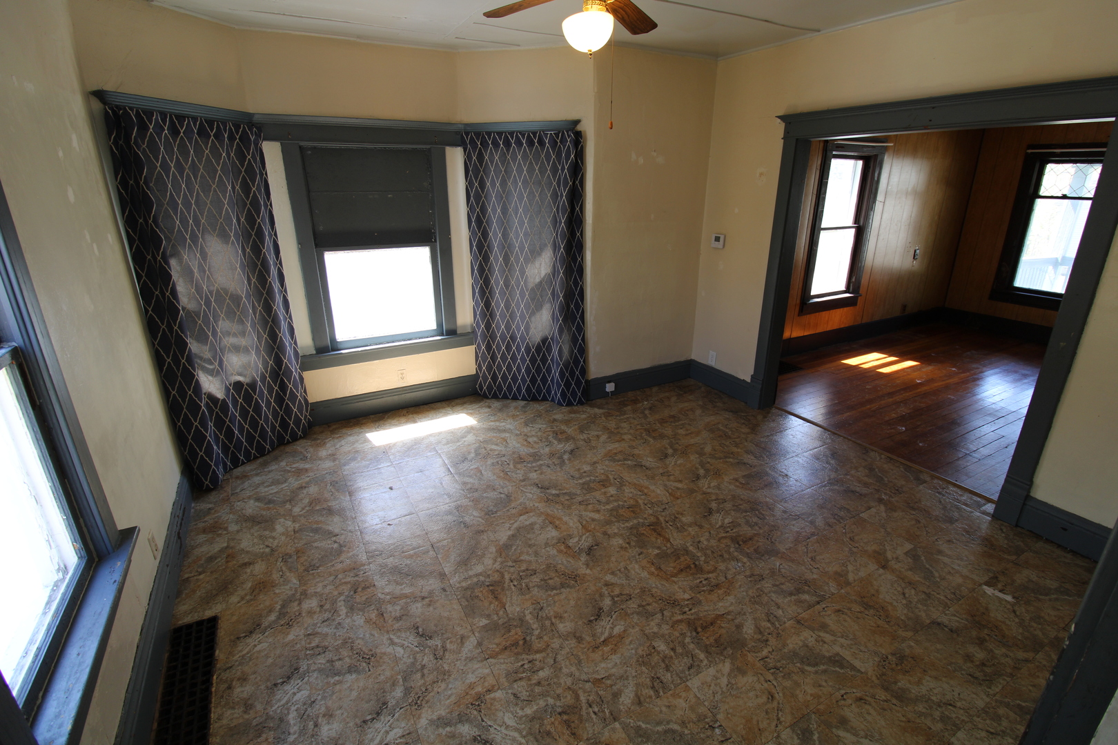 1176 22nd Street Moline, IL 61265 - Photo 5 of 19 wooden floor in an empty room with a window
