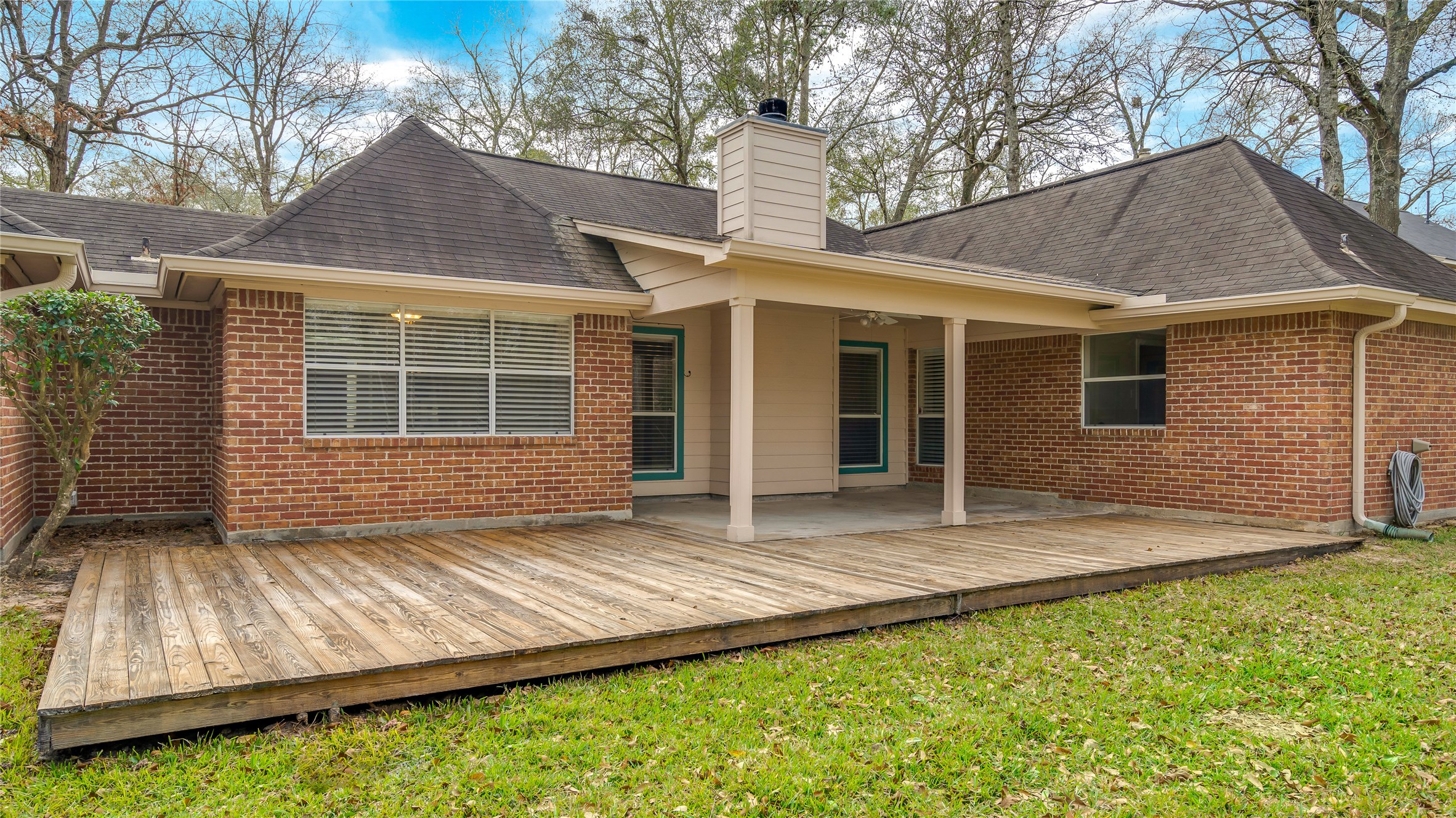 2460 Pebblebrook Circle Conroe, TX 77384 - Photo 25 of 27 Covered patio and extended deck for additional seating