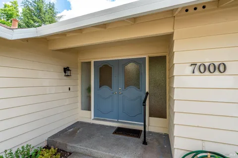 a view of front door and wooden door