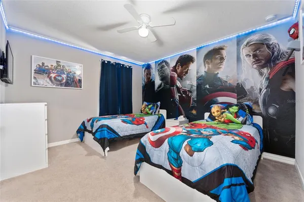 a bedroom with two beds and a large closet