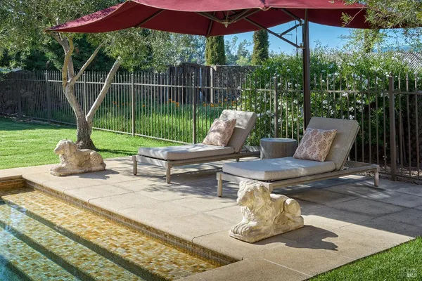 a bedroom with a bed and ceiling fan