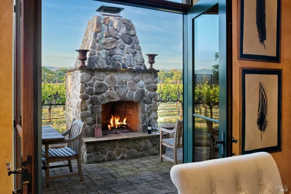 a kitchen with stainless steel appliances granite countertop a stove and a white cabinets