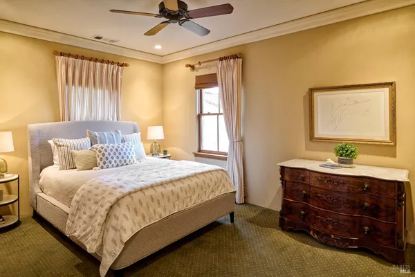 a bedroom with a bed and a mirror