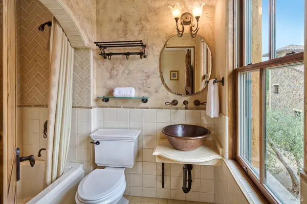 a view of a park with iron fence