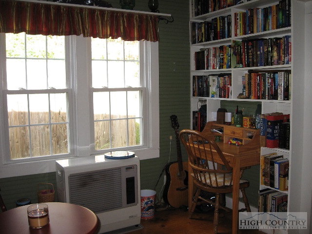 408 Bee Tree Road Lansing, NC 28643 - Photo 10 of 10 a dining room with furniture and a book shelf