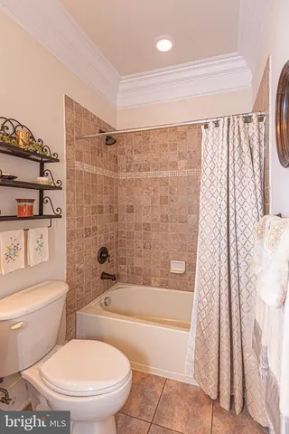 a kitchen with stainless steel appliances granite countertop a sink a stove and a wooden floors