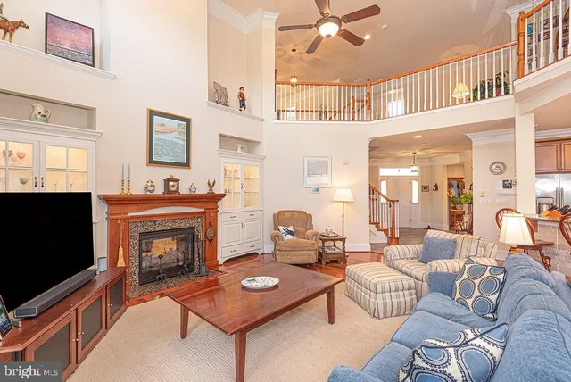a view of a hallway with paintings on the wall
