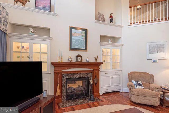 a bath tub sitting in a bathroom next to a window