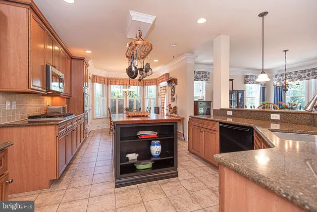 a bedroom with furniture and a large window