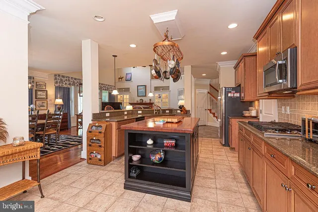 a bedroom with furniture and a large window