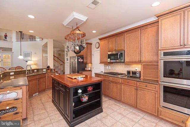 a view of a lake with a table and chairs