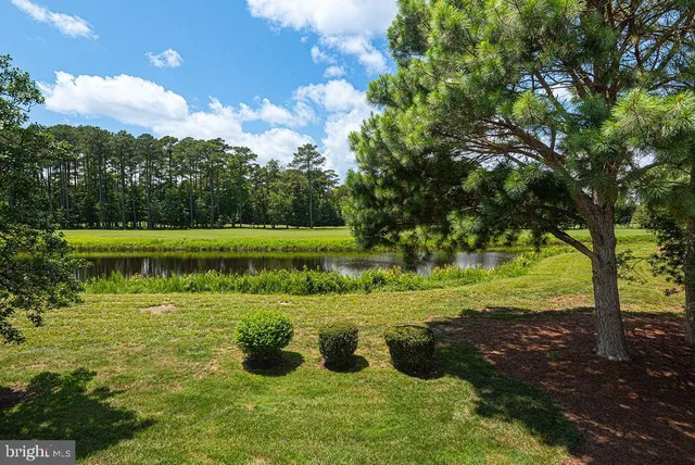 an aerial view of a house with yard swimming pool and outdoor seating