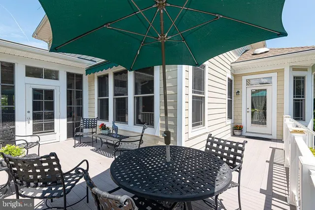 an aerial view of residential houses with yard and trees