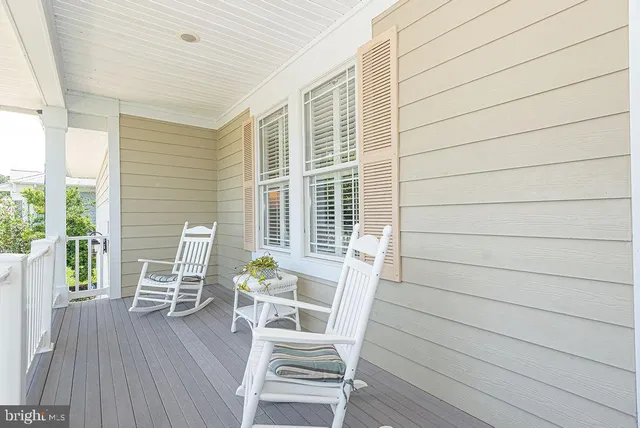 a bedroom with furniture and wooden floor