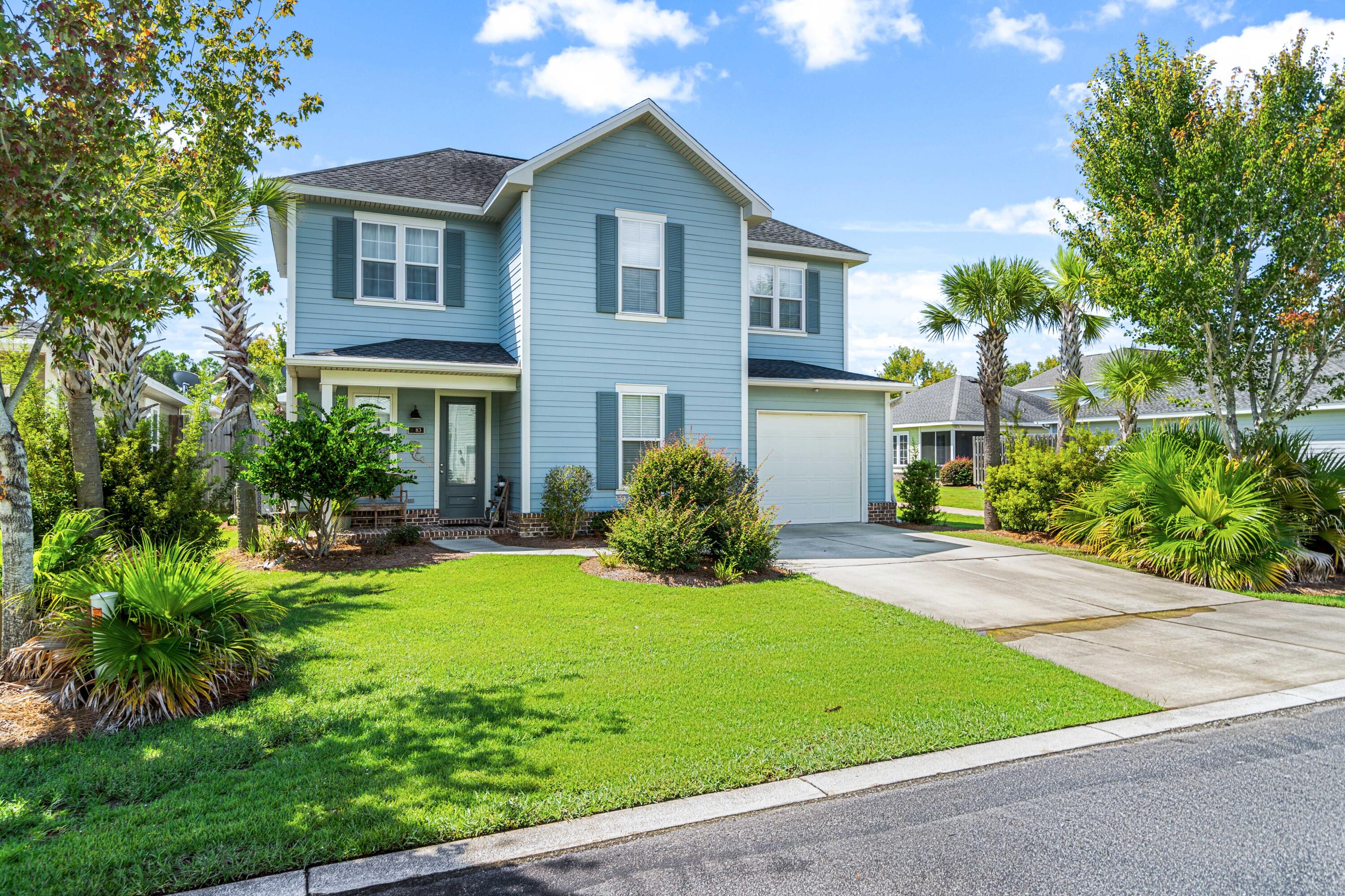 83 Hatton Court Santa Rosa Beach, FL 32459 - Photo 1 of 42 a view of a house with a yard and plants