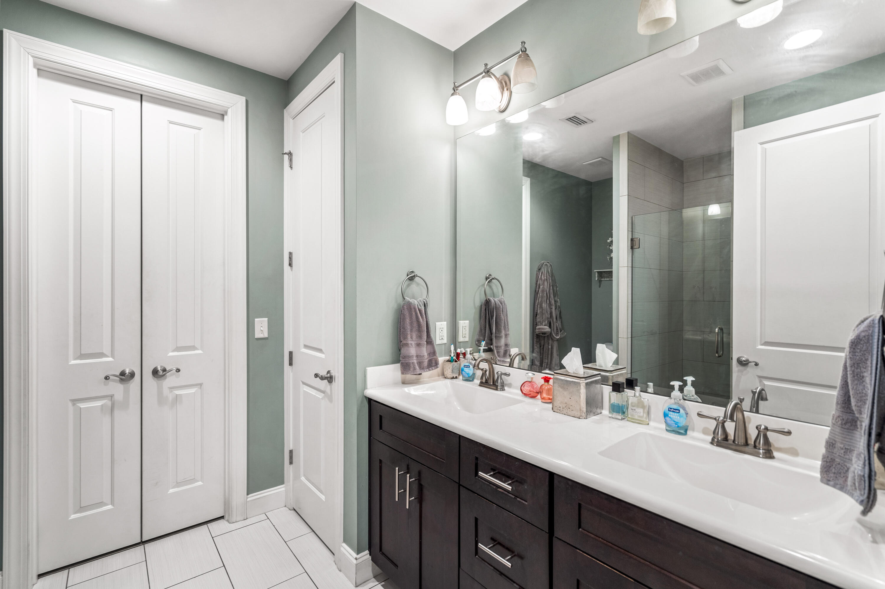 83 Hatton Court Santa Rosa Beach, FL 32459 - Photo 14 of 42 a bathroom with a double vanity sink a mirror and a shower