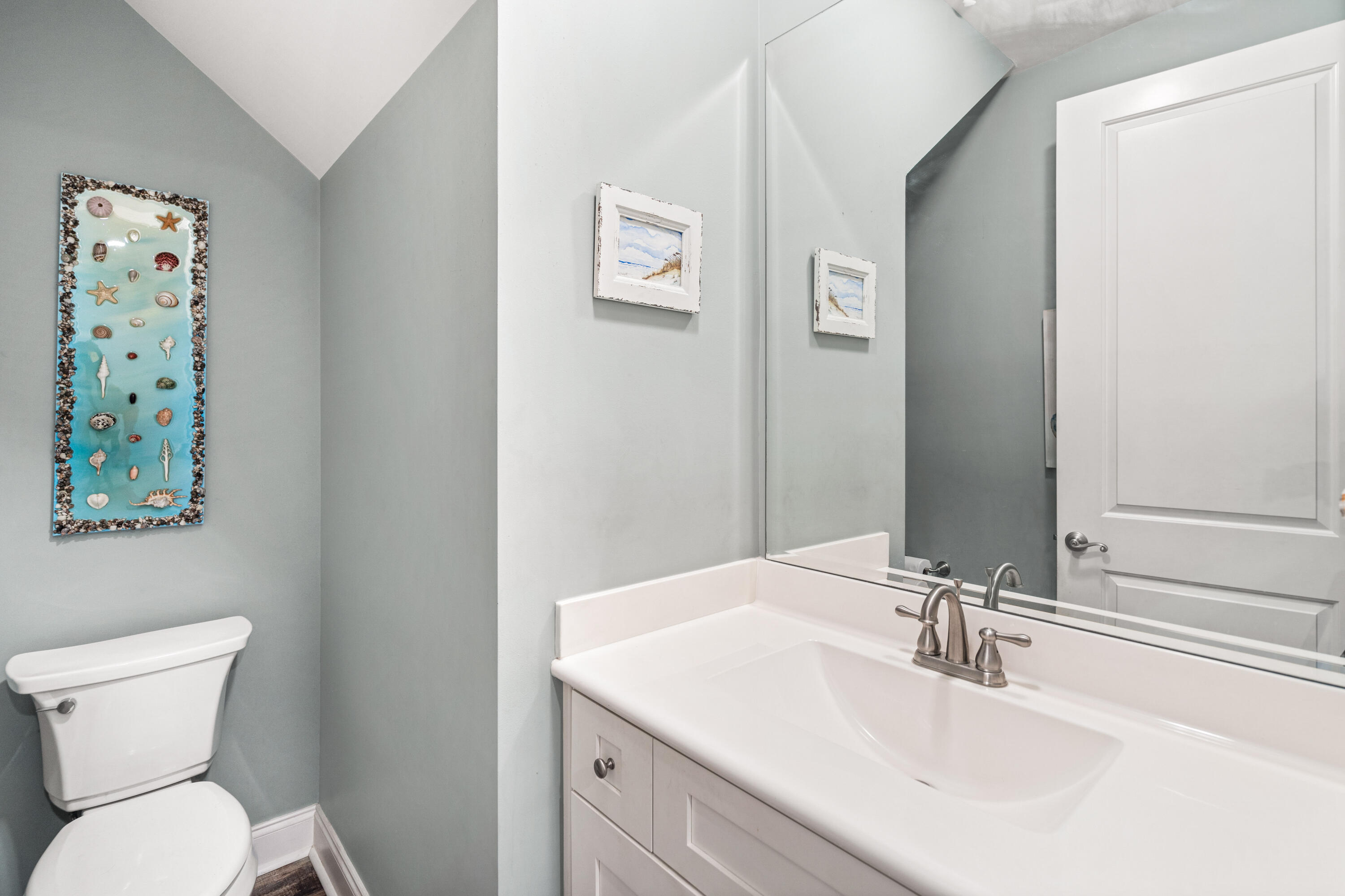 83 Hatton Court Santa Rosa Beach, FL 32459 - Photo 16 of 42 a bathroom with a toilet sink and mirror