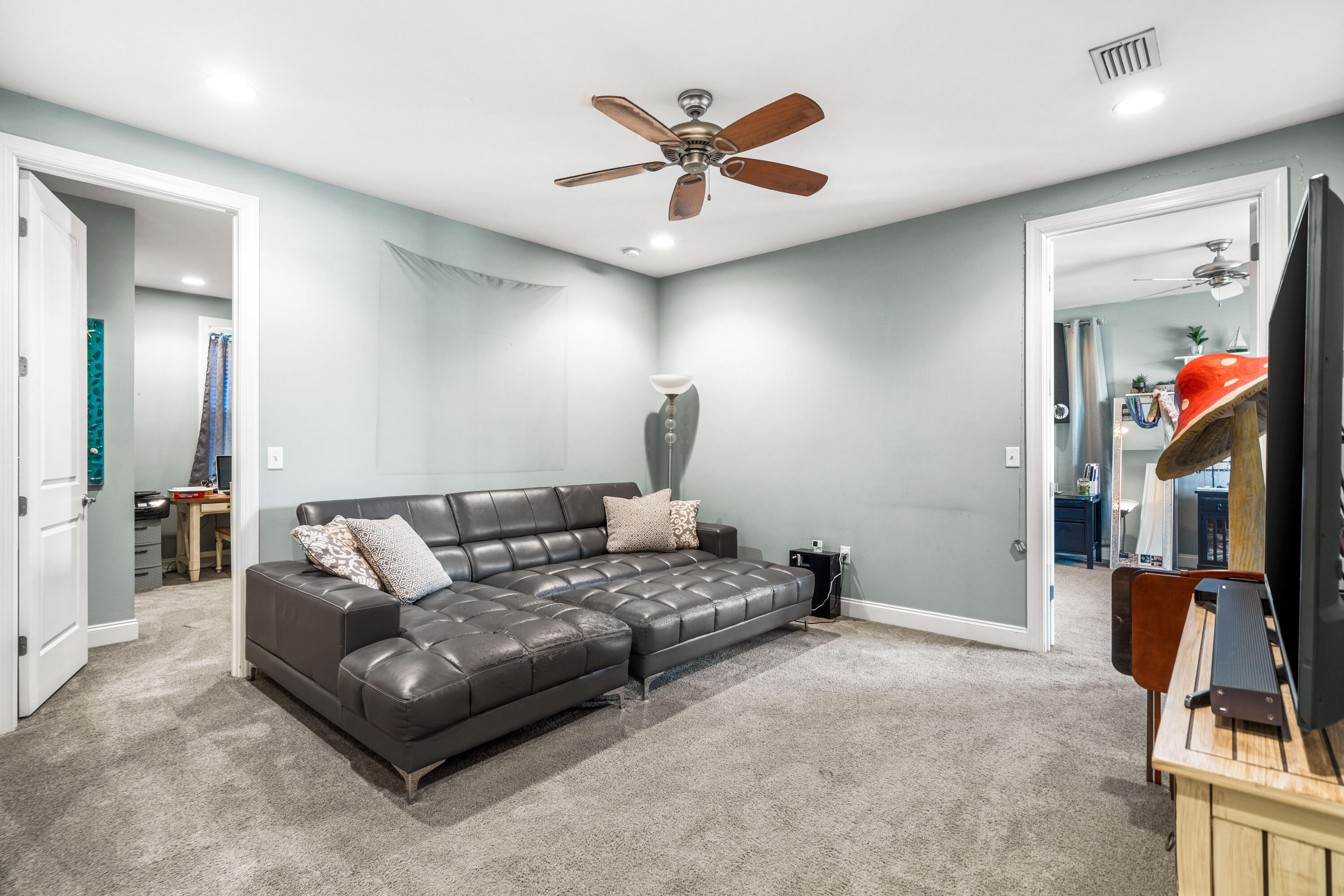 83 Hatton Court Santa Rosa Beach, FL 32459 - Photo 19 of 42 a living room with furniture a ceiling fan and a rug