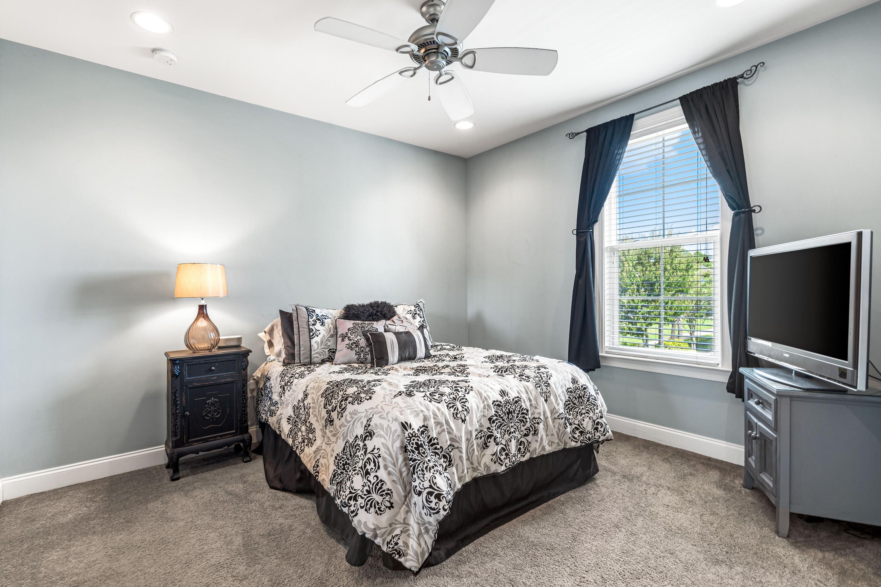 83 Hatton Court Santa Rosa Beach, FL 32459 - Photo 21 of 42 a bedroom with bed tv and window