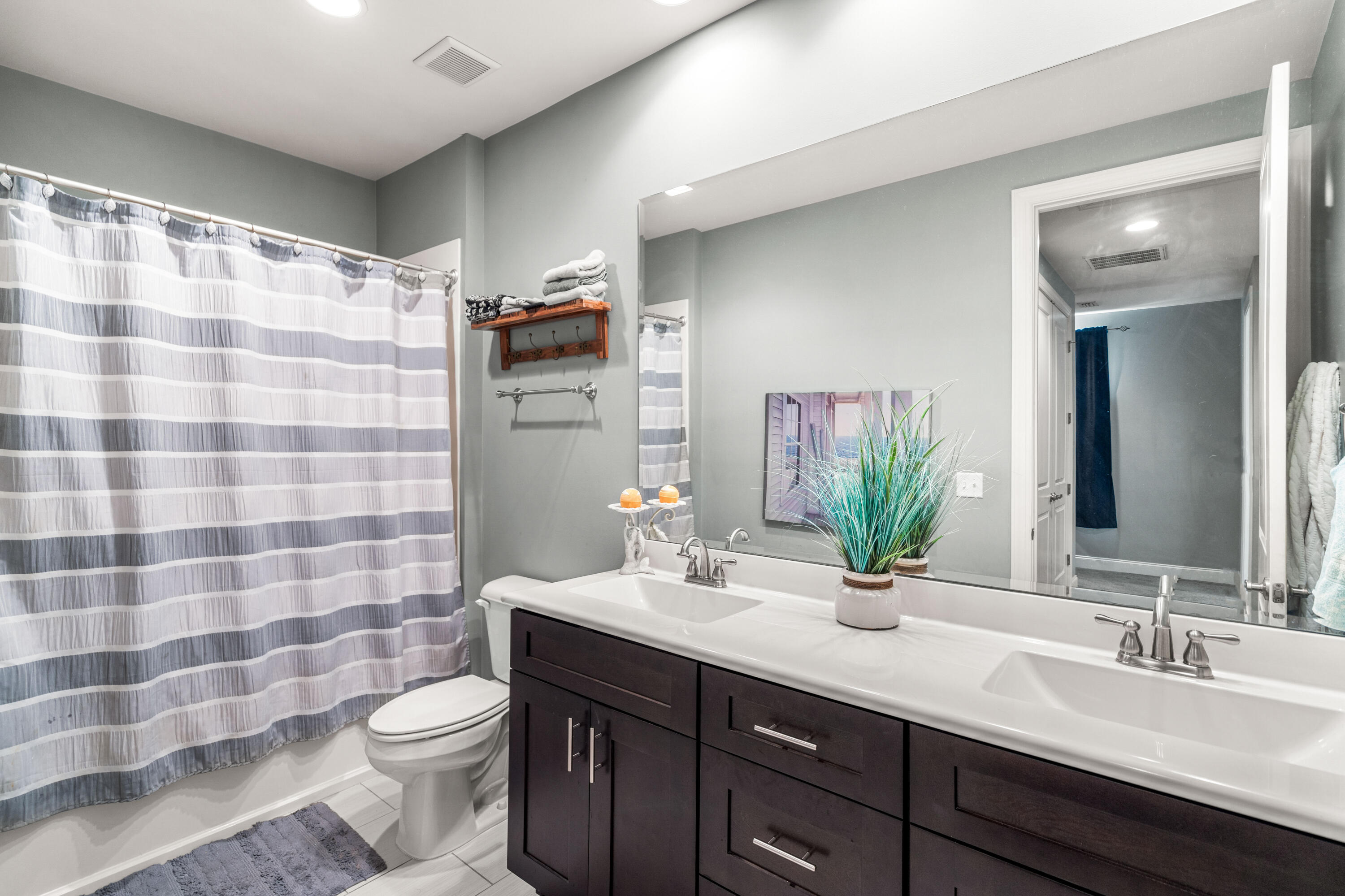 83 Hatton Court Santa Rosa Beach, FL 32459 - Photo 23 of 42 a bathroom with a double vanity sink toilet and shower