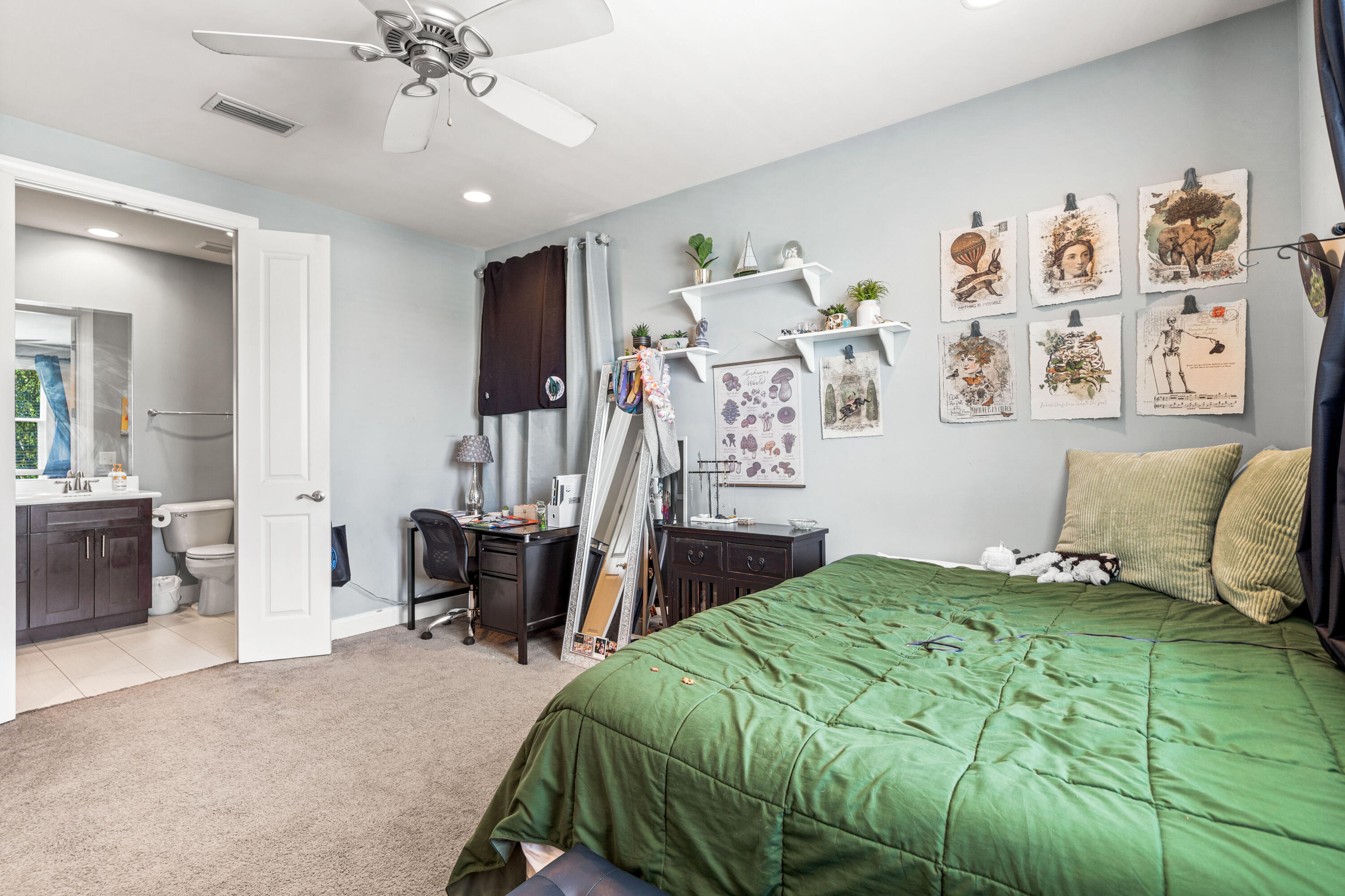 83 Hatton Court Santa Rosa Beach, FL 32459 - Photo 25 of 42 a bedroom with a bed and a chandelier