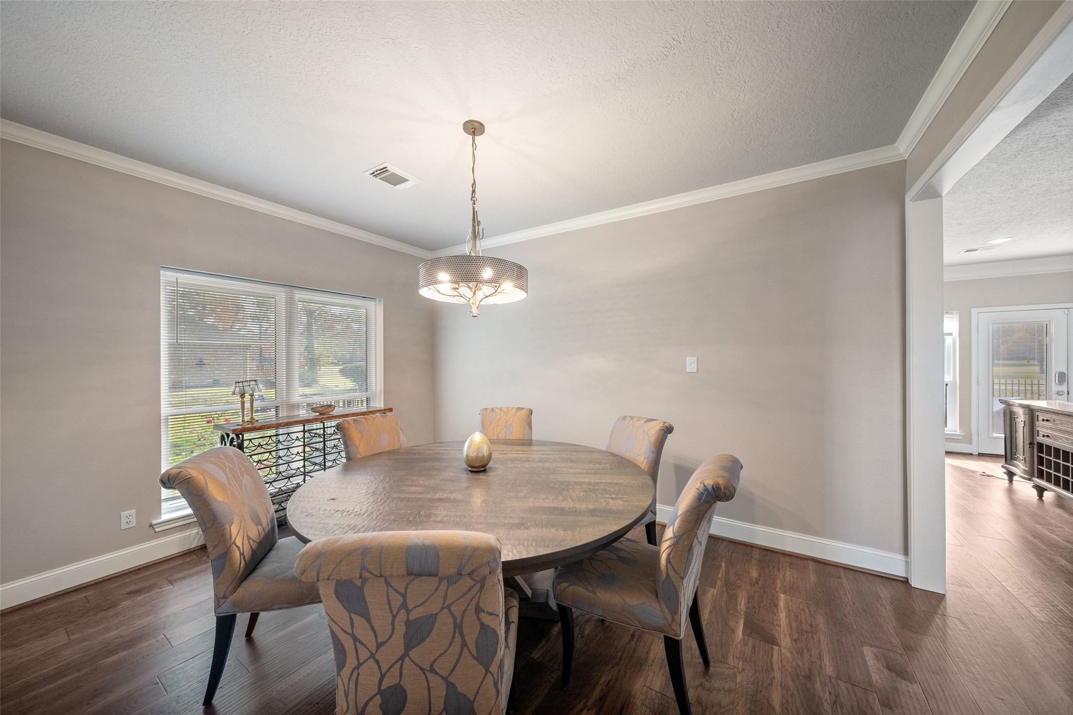 20256 Ivy Point Circle Humble, TX 77346 - Photo 12 of 36 a view of a dining room with furniture window and wooden floor