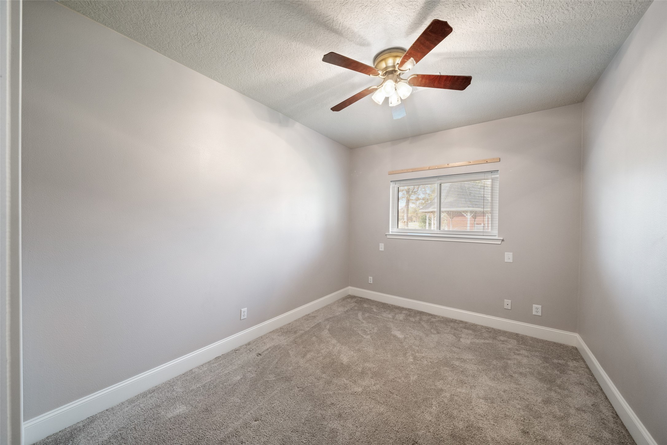 20256 Ivy Point Circle Humble, TX 77346 - Photo 25 of 36 an empty room with windows and fan