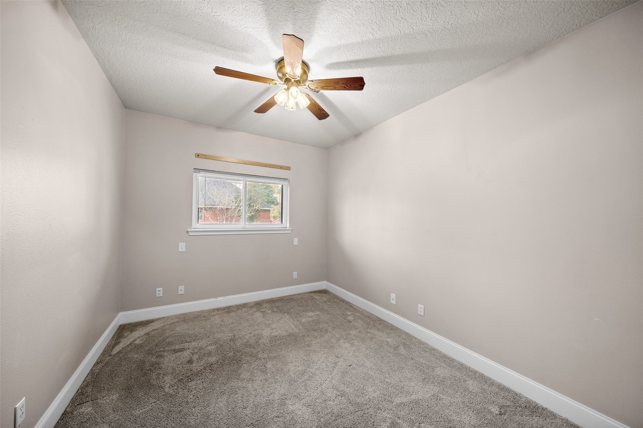20256 Ivy Point Circle Humble, TX 77346 - Photo 27 of 36 an empty room with windows and fan