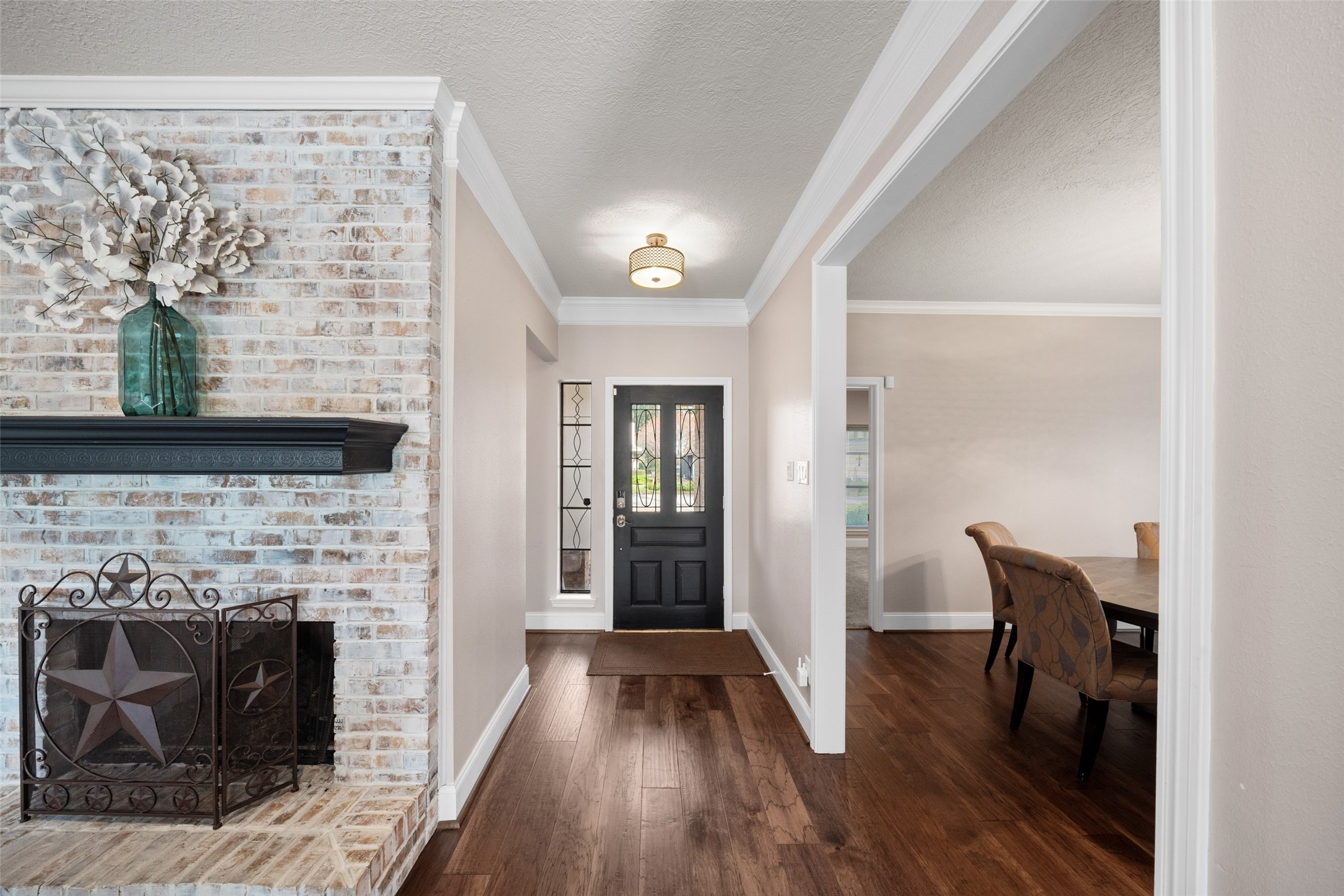 20256 Ivy Point Circle Humble, TX 77346 - Photo 4 of 36 a view of a livingroom with wooden floor and a fireplace