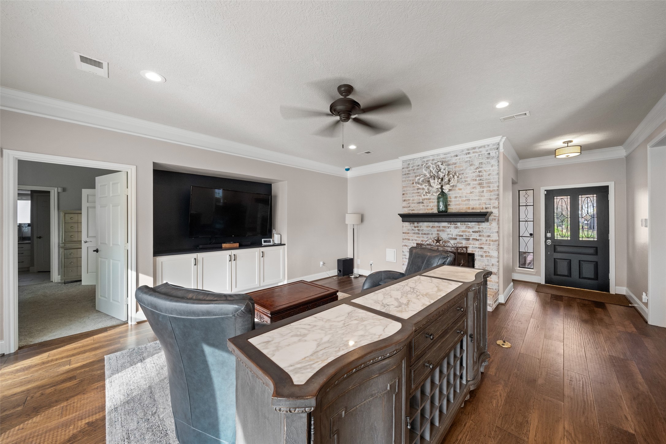 20256 Ivy Point Circle Humble, TX 77346 - Photo 7 of 36 a living room with furniture a flat screen tv and kitchen view