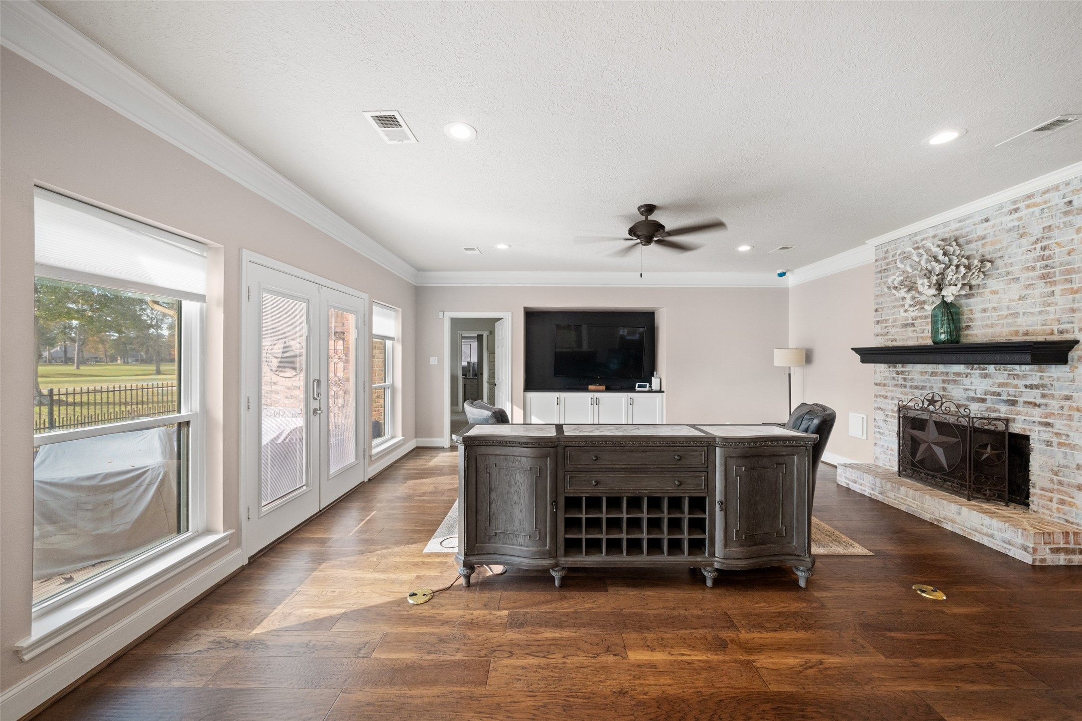 20256 Ivy Point Circle Humble, TX 77346 - Photo 9 of 36 a living room with furniture a flat screen tv and a fireplace