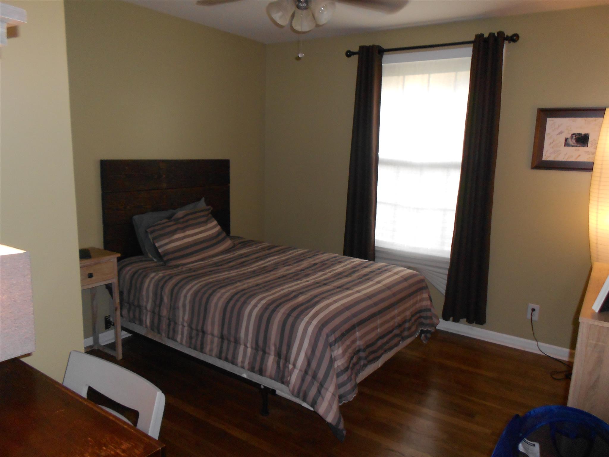 314 Gates Road Goodlettsville, TN 37072 - Photo 13 of 29 a bedroom with a bed and wooden floor