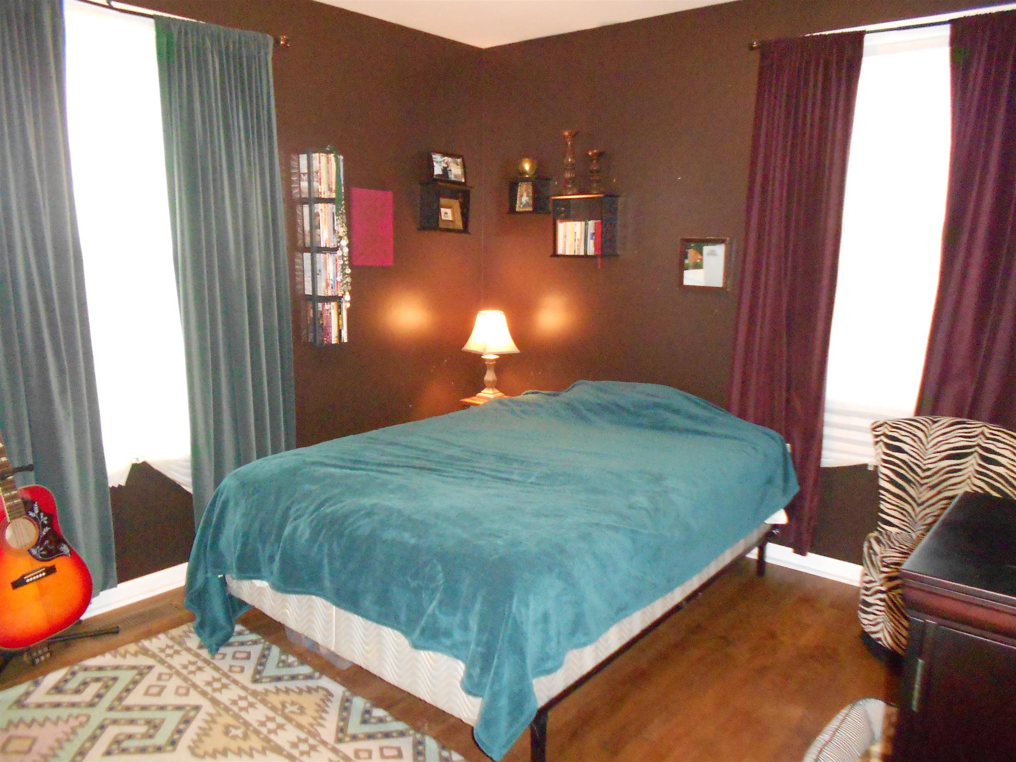 314 Gates Road Goodlettsville, TN 37072 - Photo 17 of 29 a bedroom with a bed and lamp next to a window