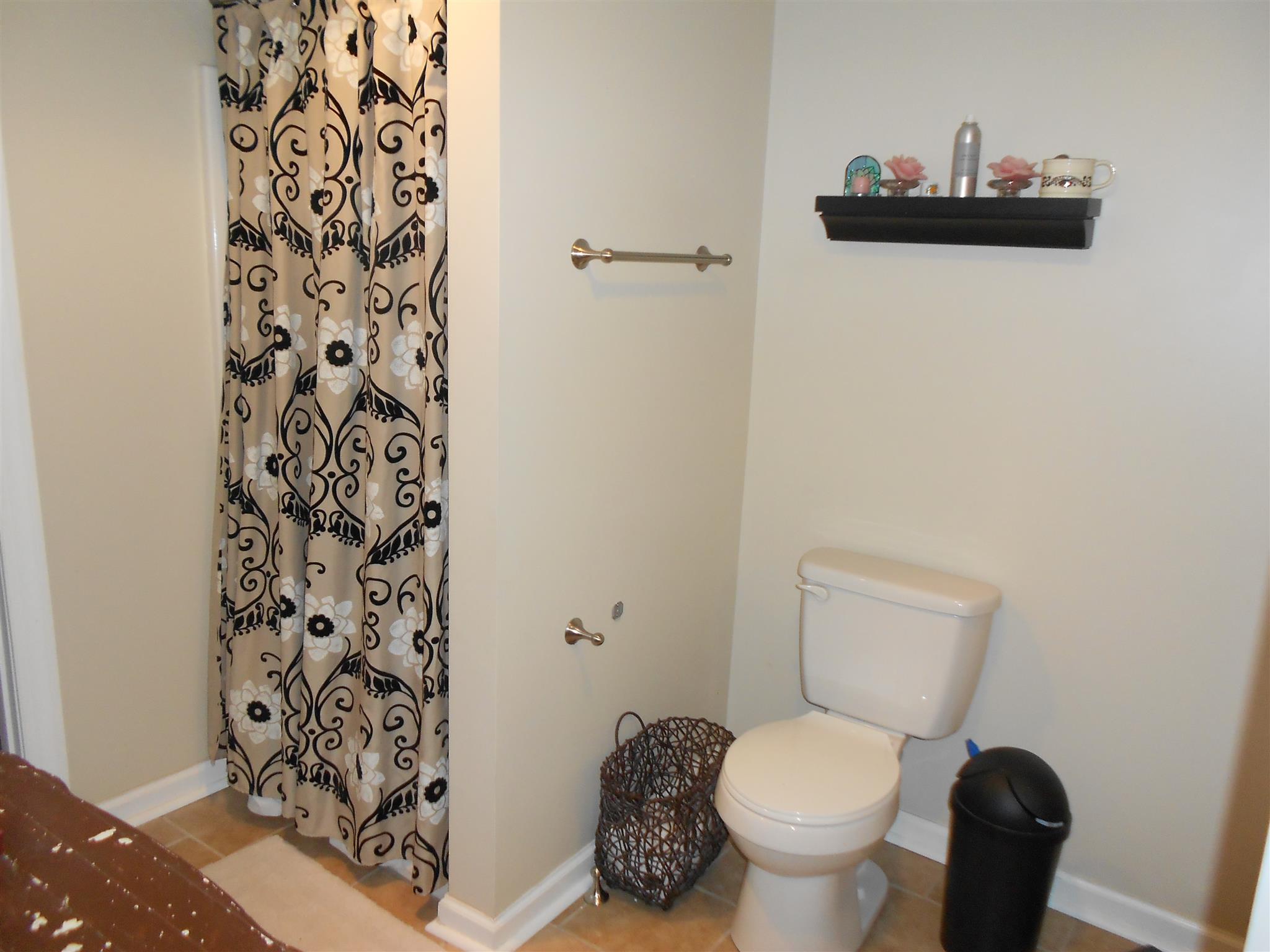 314 Gates Road Goodlettsville, TN 37072 - Photo 20 of 29 a white toilet sitting next to a bathroom sink