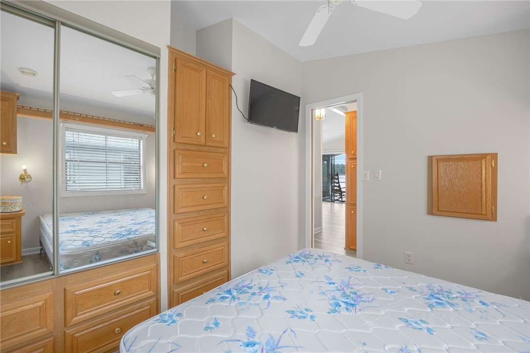 1230 Melton Road, Unit 25 West Union, SC 29696 - Photo 10 of 46 Functional bedroom featuring built-in cabinetry, mirrored closet doors, and a well-placed window.