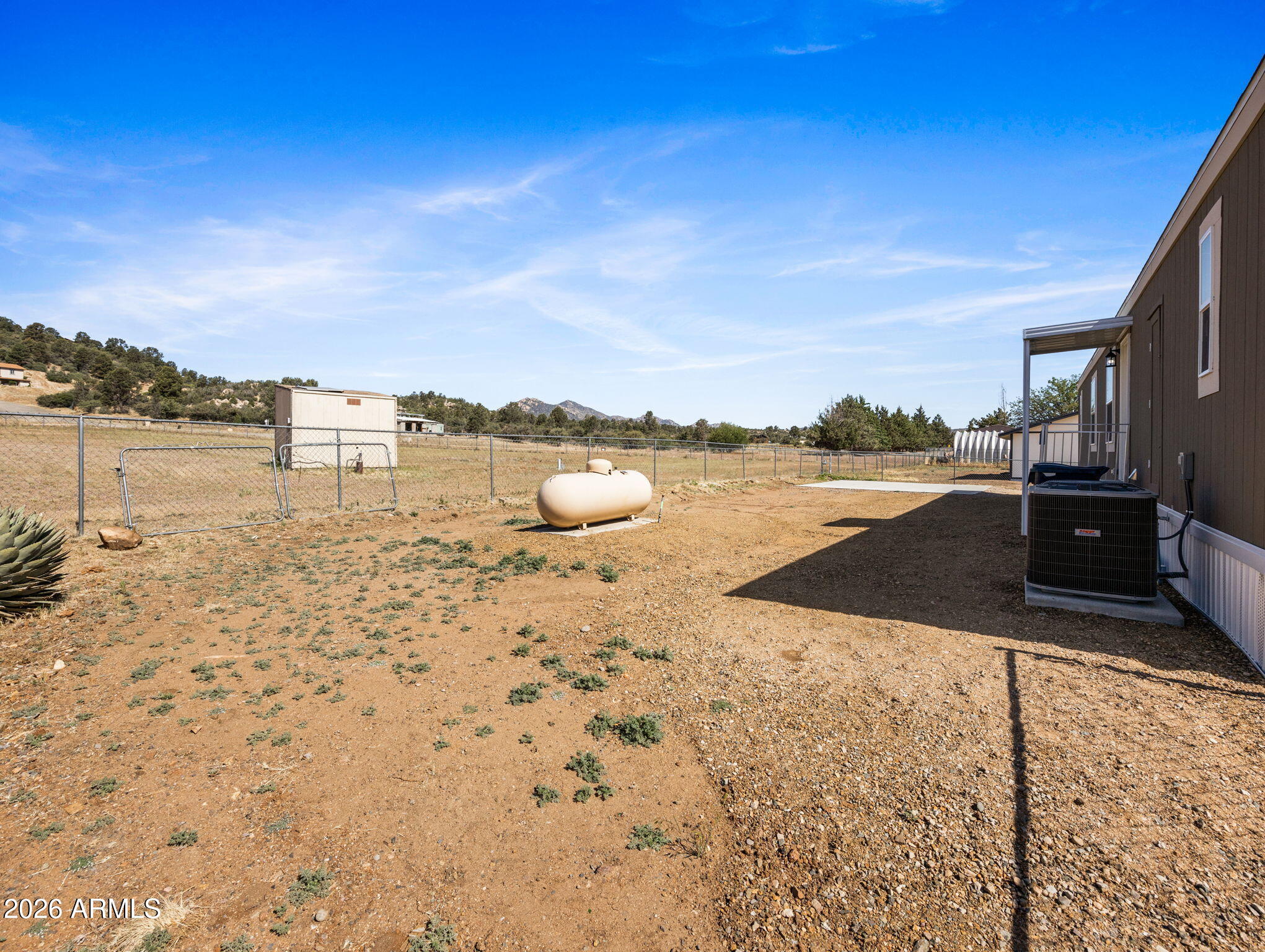 18296 Frontier Road Peeples Valley, AZ 86332 - Photo 25 of 44 a view of a lake with beach