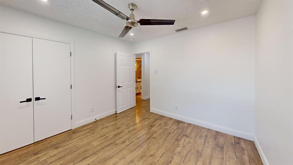 2131 Blossom Lane Richardson, TX 75081 - Photo 11 of 22 a view of an empty room with wooden floor