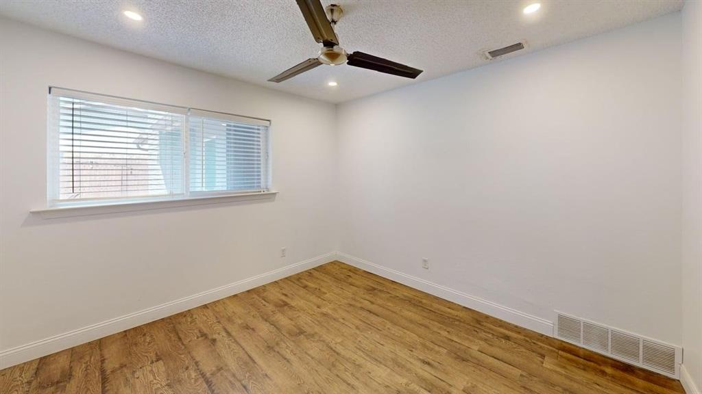 2131 Blossom Lane Richardson, TX 75081 - Photo 12 of 22 an empty room with a window