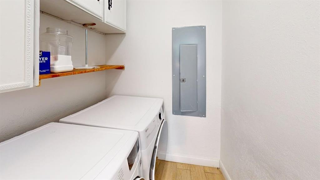 2131 Blossom Lane Richardson, TX 75081 - Photo 22 of 22 a utility room with dryer and washer