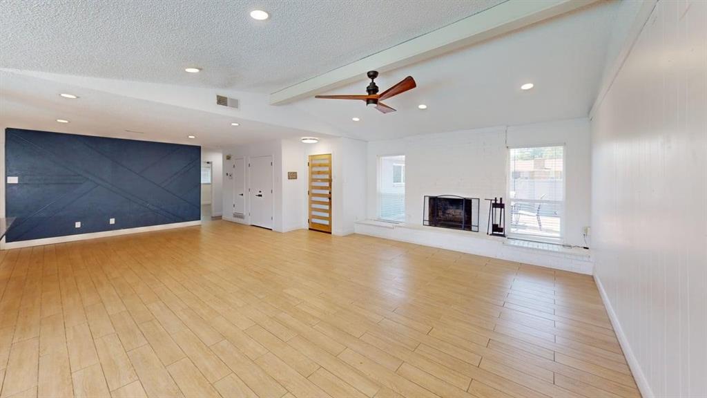 2131 Blossom Lane Richardson, TX 75081 - Photo 5 of 22 a view of a livingroom with a fireplace