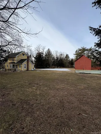 a backyard of apartments with large trees
