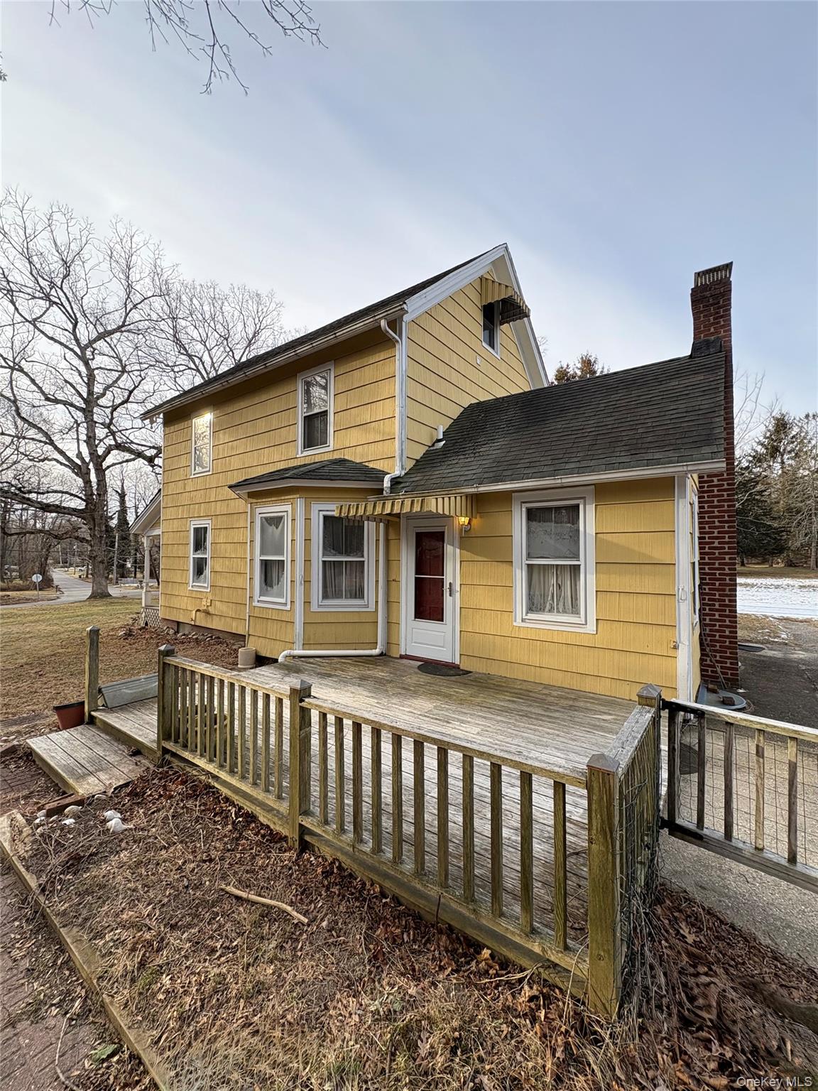 58 Coram Swezeytown Road Middle Island, NY 11953 - Photo 13 of 26 a front view of a house with a yard