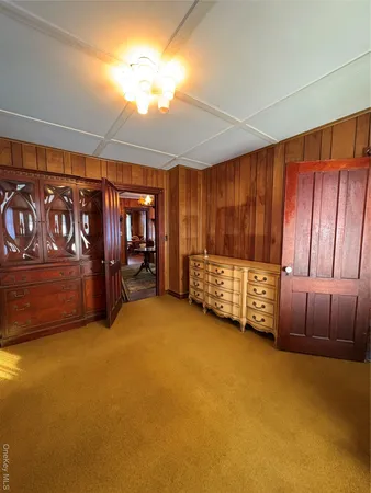 a bedroom with a bed window and couch