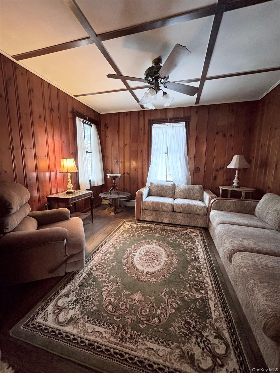 58 Coram Swezeytown Road Middle Island, NY 11953 - Photo 22 of 26 a living room with furniture and a large window