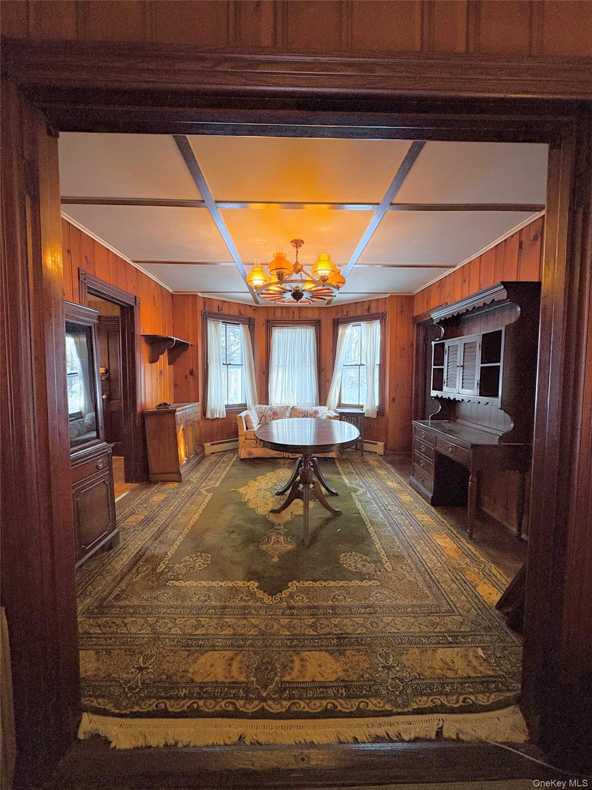 58 Coram Swezeytown Road Middle Island, NY 11953 - Photo 23 of 26 a room with lots of furniture and a rug