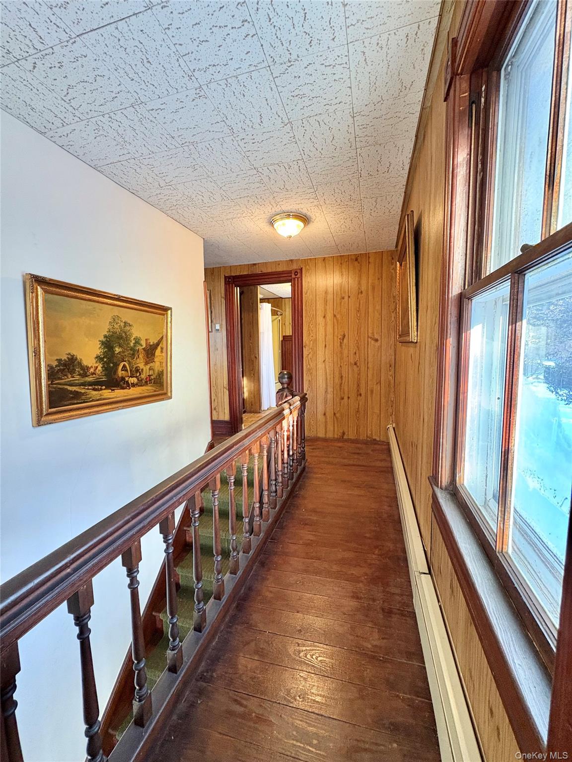58 Coram Swezeytown Road Middle Island, NY 11953 - Photo 3 of 26 a view of a hallway with wooden floor and stairs