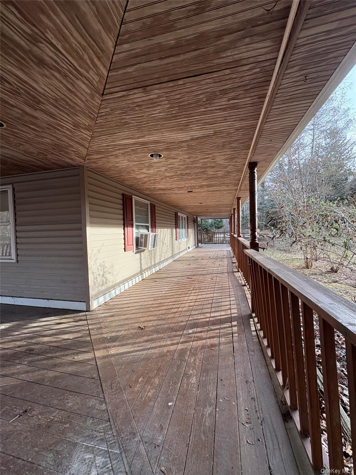 58 Coram Swezeytown Road Middle Island, NY 11953 - Photo 10 of 26 a porch with seating space