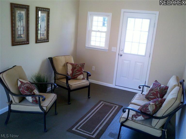 3800 Center Road Ashtabula, OH 44004 - Photo 22 of 25 The sunroom/breezeway has heat and AC. A six foot slider on the east wall leads to the brick patio area. When the front window and the back slider are open, you can feel the breeze!